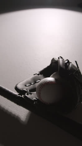 Monochromatic-Vertical-Video-Close-Up-Studio-Baseball-Still-Life-With-Bat-Ball-And-Catchers-Mitt